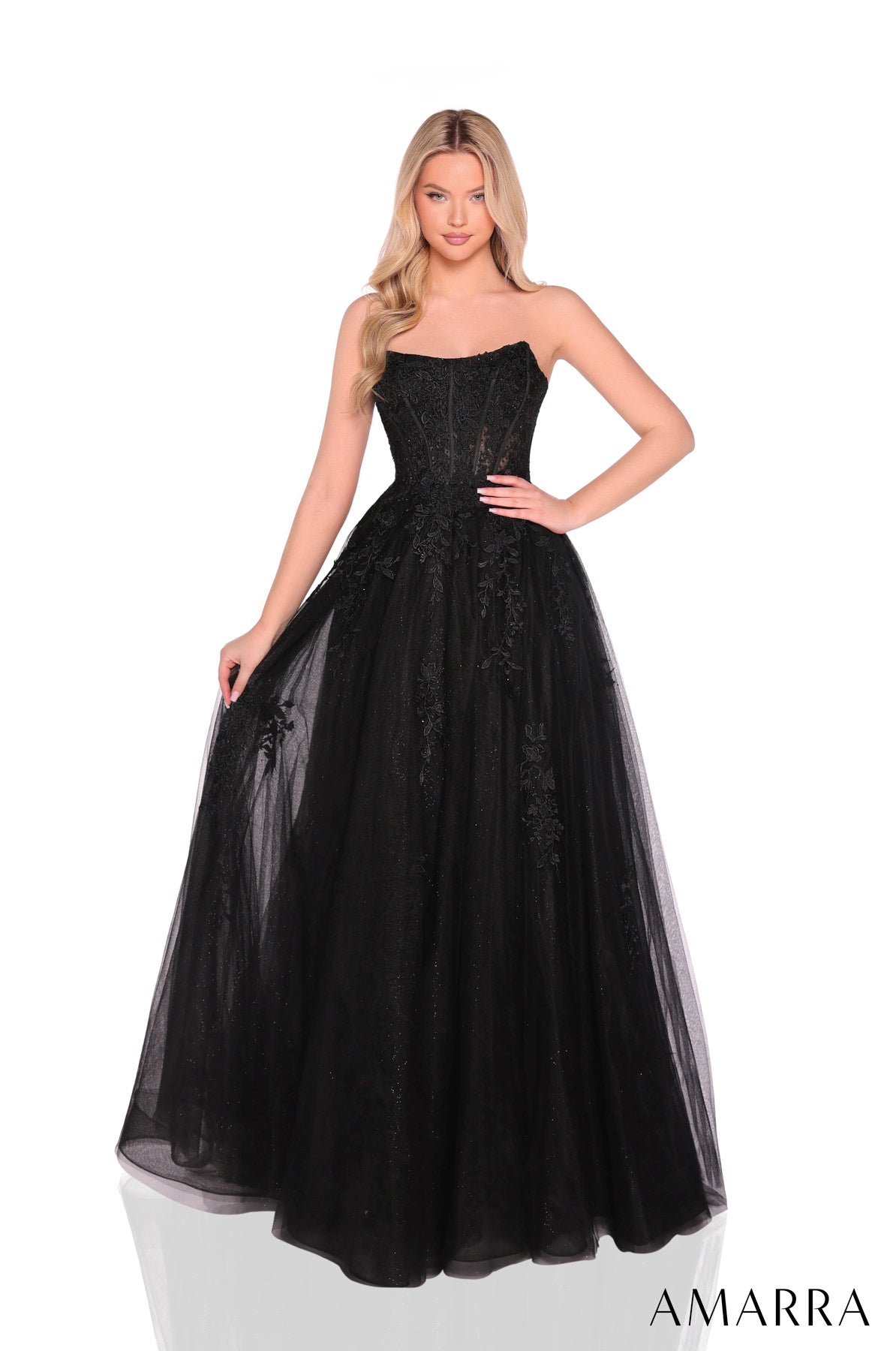 Black strapless gown with floral details on a white background, featuring the brand 'Amarra'. THE BRIDAL COMPANY