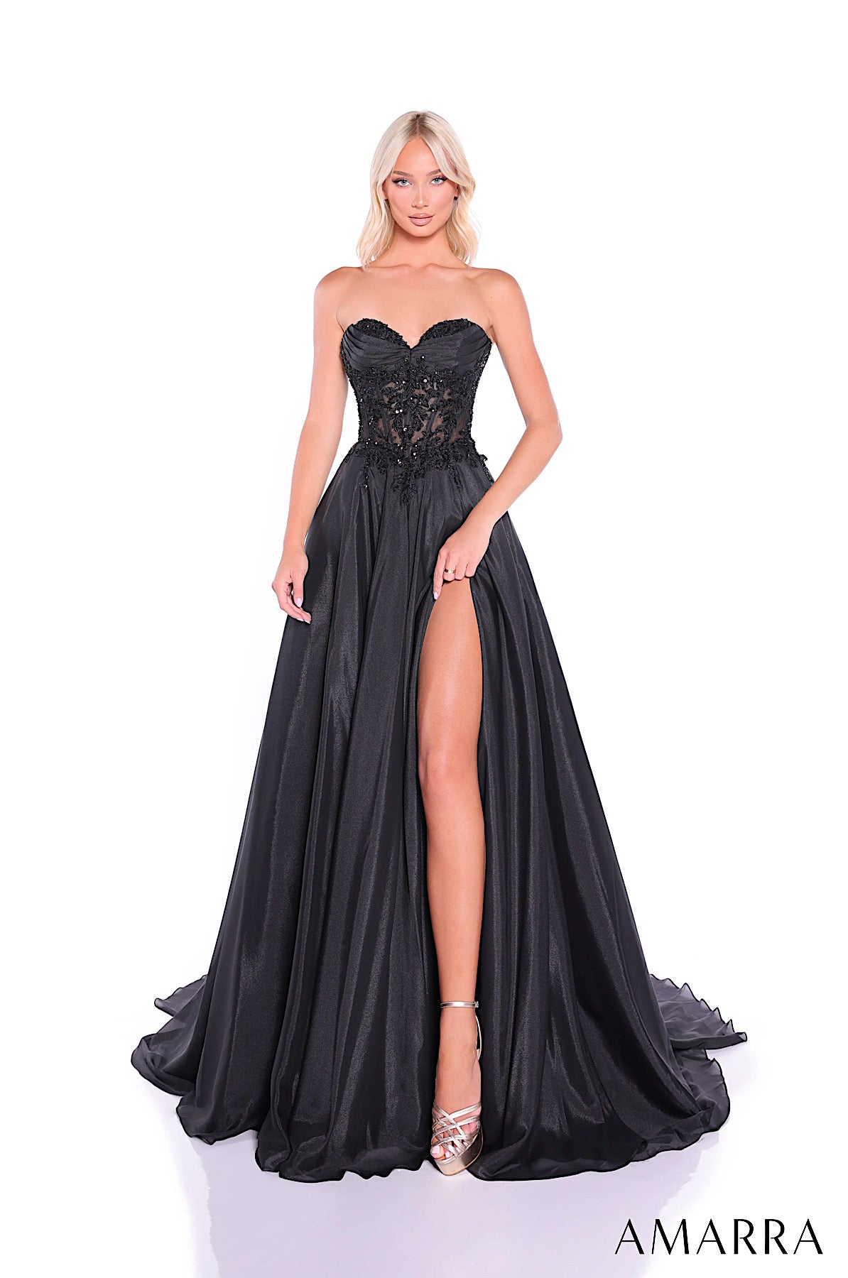 Black evening gown with lace bodice and high slit on a white background, brand 'AMARRA' visible.