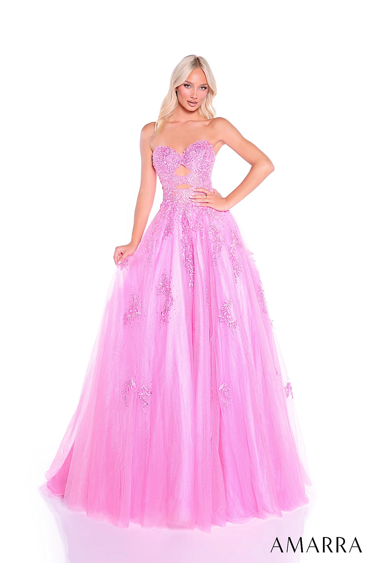 Pink strapless evening gown with floral details on a white background, brand 'AMARRA' visible.
