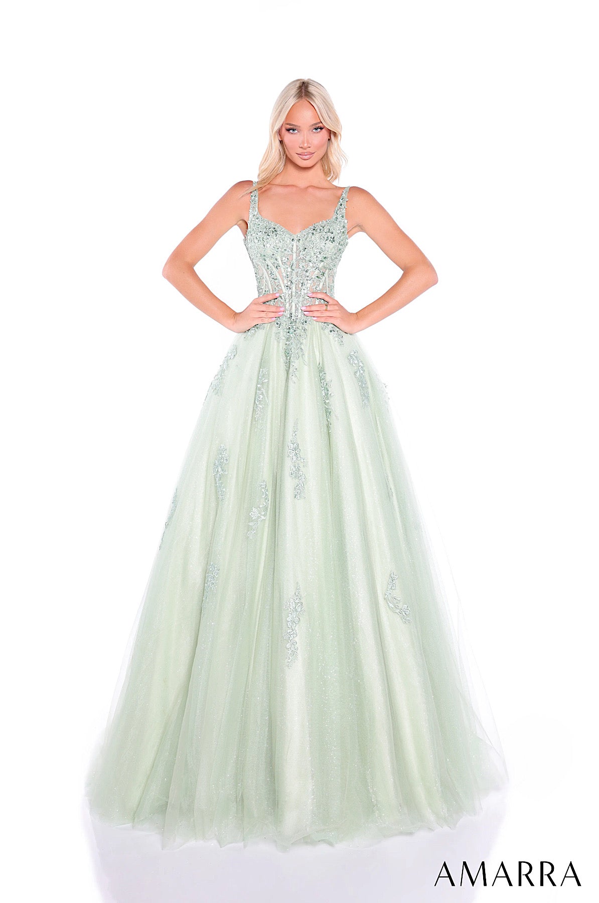 Light green evening gown with beaded details on a white background, featuring the brand 'AMARRA'.